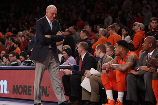 Jim Boeheim turns toward his bench while DaJuan Coleman watches on from the sideline. The freshman center played just four minutes in the loss.