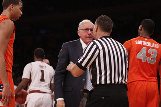 Jim Boeheim argues with a referee in SU's loss. The defeat moves Boeheim to  900-305 all-time.