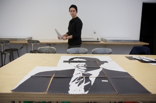 Miller inspects an initial draft of his portrait of President Barack Obama. 