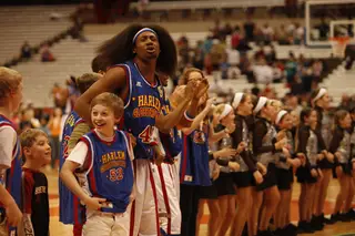 Moose's hair flops everywhere as he participates in the YMCA with fans and local middle school cheerleaders.