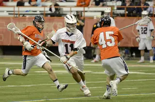 Brian Megill carries the ball out of SU's defensive end. The senior captain won a ground ball and caused a turnover but struggled to contain Hobart's Alex Love.