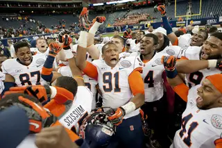 Syracuse celebrates following its victory over Minnesota in the Texas Bowl.