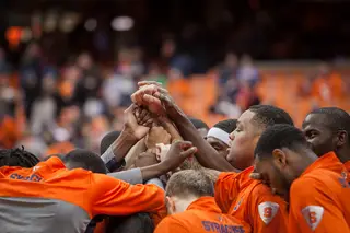 Syracuse players huddle moments before the start of their matchup against Binghamton. 