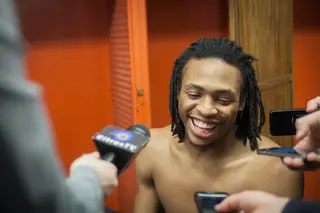 Ron Patterson smiles in the locker room following Syracuse's dominant win over Binghamton. Patterson saw time at point guard and chipped in a career-high 10 points in 15 minutes. 