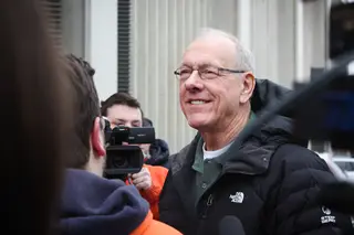 Jim Boeheim talks to students and press after arriving at Gate E of the Carrier Dome. Boeheim spoke with members of Otto's Army and took pictures with fans.