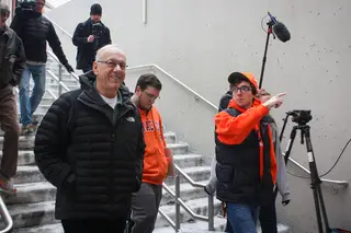 Brad Slavin, a senior television, radio and film and information management and technology major, leads Jim Boeheim down into Boeheimburg, where some students have been camping out since Jan. 19. Boeheim expressed his appreciation for the fans' dedication.