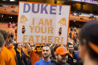 A member of Otto's Army gives a Duke fan a warm Carrier Dome welcome. 