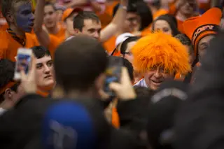 ESPN's Dick Vitale introduces himself to members of Otto's Army and dons a fan's Orange wig.  