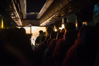 Early morning sunlight shines through bus windows as the marching band makes their way to the Super Bowl on Sunday.