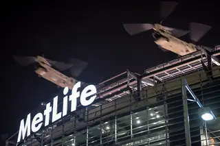 Two U.S. Army Chinook helicopters pass over MetLife Stadium as a part of the military flyover during the Super Bowl pregame show on Sunday evening.