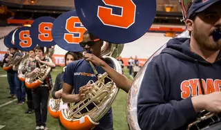 Morgan Christopher Edwards, a senior aerospace engineering major, performs in the tuba line during practice in the Carrier Dome the week before the Super Bowl