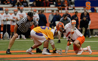 Chris Daddio gets set for a faceoff in Syracuse's 17-16 overtime win over Albany. 