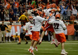 Syracuse celebrates after Henry Schoonmaker scores the game-winning goal in overtime. 