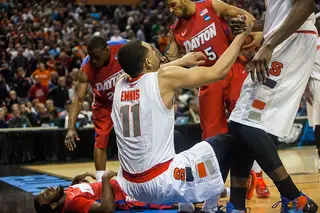 Ennis is helped up after falling to the floor. 