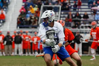A Duke player uses his body to pass a Syracuse defender late in the blowout. 