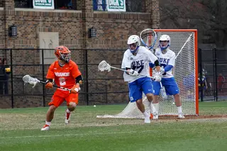 Rice operates on the left side of the Syracuse attack, searching for a teammate to cut toward the doorstep. 