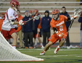 Kevin Rice faking away from an oncoming Cornell defender. 