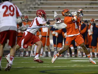 Lecky winds up for a shot as a Cornell defender lunges forward to block him. 