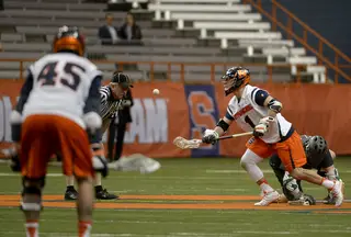 Chris Daddio corrals the ball after winning a faceoff. The senior won 10-of-22 draws in the game. 