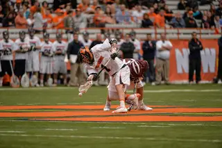 Syracuse faceoff specialist Chris Daddio collects a faceoff. 