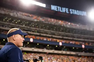 Syracuse head coach Scott Shafer takes in the view of the record setting crowd at MetLife Stadium. 76,802 fans flocked to the Meadowlands and set the stadium attendance record for a college football game.