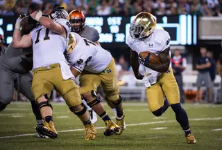 Notre Dame running back Greg Bryant surveys the left side of the field as he moves toward the line of scrimmage.