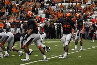 Syracuse freshman linebacker Zaire Franklin communicates with SU's secondary while pointing to the Wolfpack offense.
