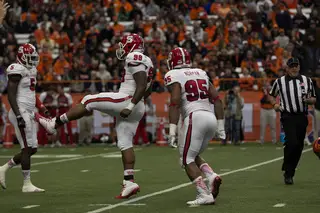 N.C. State defensive tackle B.J. Hill (98) celebrates with defensive end Art Norman during the first half.