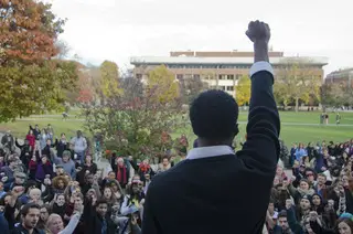 Colton Jones, a senior psychology major and one of the Diversity and Transparency Rally organizers, leads the crowd in a chant during the DAT Rally on Monday afternoon. 