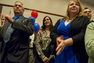 Abby Maffei, wife of Dan Maffei, stands as part of the crowd in the OnCenter Tuesday night. Her husband was defeated by John Katko by about 20 percent for a seat in the United States House of Representatives.
