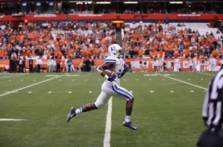 A Duke player runs up the sideline during the first half. The Blue Devils took a 10-3 lead into halftime. 