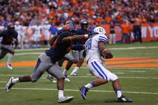 A Syracuse defender tries to make a tackle. 