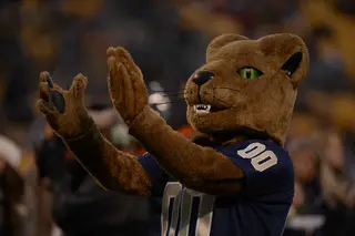 Roc the Panther claps its hands together.