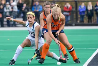 Kati Nearhouse fends off Olivia Bolles during the fourth-seeded Orange's 1-0 loss to UConn in the national championship on Sunday. Nearhouse, a grad student, joined SU's two seniors in wrapping up her college career in College Park, Maryland.