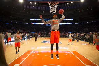 Syracuse's B.J. Johnson pulls down a rebound in warmups prior to the game. 