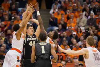 Mitoglou looks for a teammate as the SU defense converges.