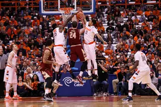 Clifford goes up for a layup as the Syracuse interior tires to defend. 