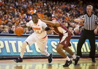 Point guard Kaleb Joseph drives the ball down the court past Florida State's defense, looking for an opening.