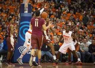 SU forward Tyler Roberson defends in the post while FSU's Kiel Turpin tries to make a play. 