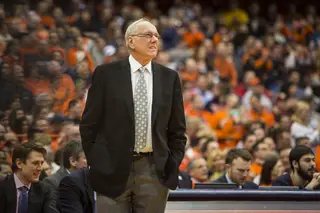SU head coach Jim Boeheim looks on to the court with his hands in his pockets. 