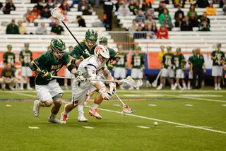 Rice chases a ground ball as a pair of Siena players contest him.