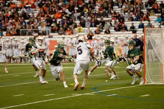 Syracuse senior Nicky Galasso tries to bounce a shot past Siena goalie Tommy Cordts.