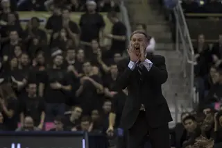 Pittsburgh head coach Jamie Dixon calls out commands to his team from the sideline.