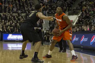 Ron Patterson holds the ball as Pitt's James Robinson defends. Patterson scored just two points off the bench. 