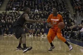 Point guard Kaleb Joseph dribbles behind the 3-point line and looks to find an option to pass to.