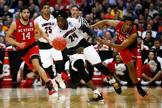 The Cardinal's Montrezl Harrell (24) goes after a loose ball while NCSU's Ralston Turner (22) gives chase.