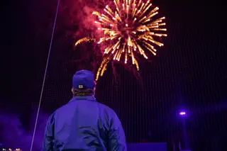 A fan watches the fireworks show after the Mets beat the Scranton/Wilkes-Barre Railriders 5-2.