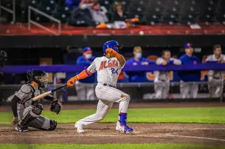 Syracuse right fielder Khalil Lee follows through his swing during the Mets' first game.