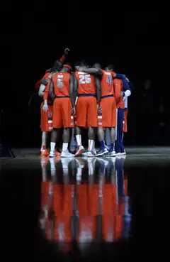 Syracuse forms its last-ever Big East huddle on the floor of Madison Square Garden.