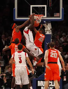 Louisville's Montrezl Harell (#24) dunks the ball after forcing his way through Syracuse's defense. 